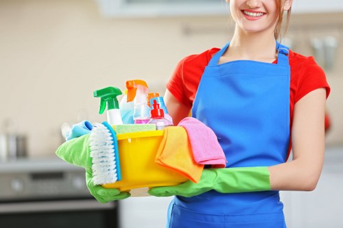 Professional cleaner maintaining a hallway