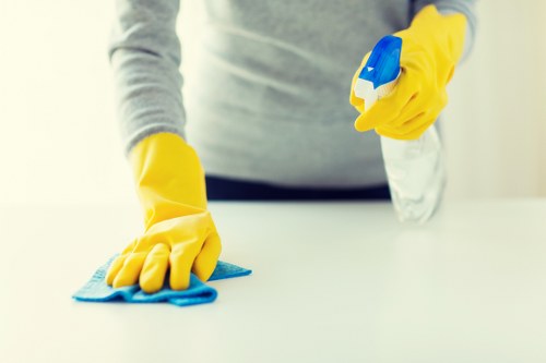 Spot cleaning a mattress stain with a microfiber cloth