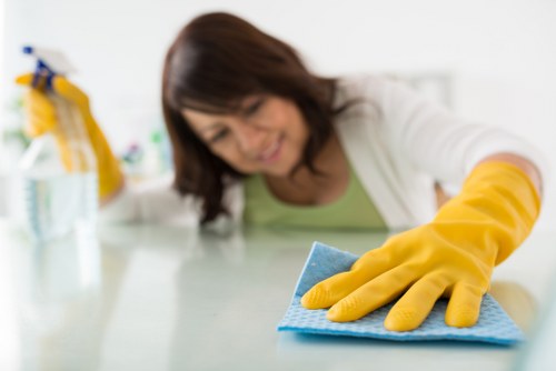 Staff using appropriate protective equipment during daily work tasks