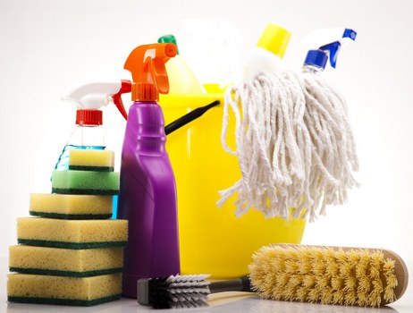 Vacuuming and dusting a living room after moving out